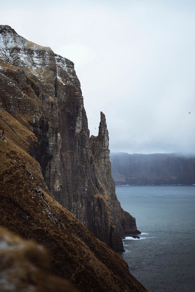 View of Tr&oslash;llkonufingur or Witches Finger, island in the Faroe Islands