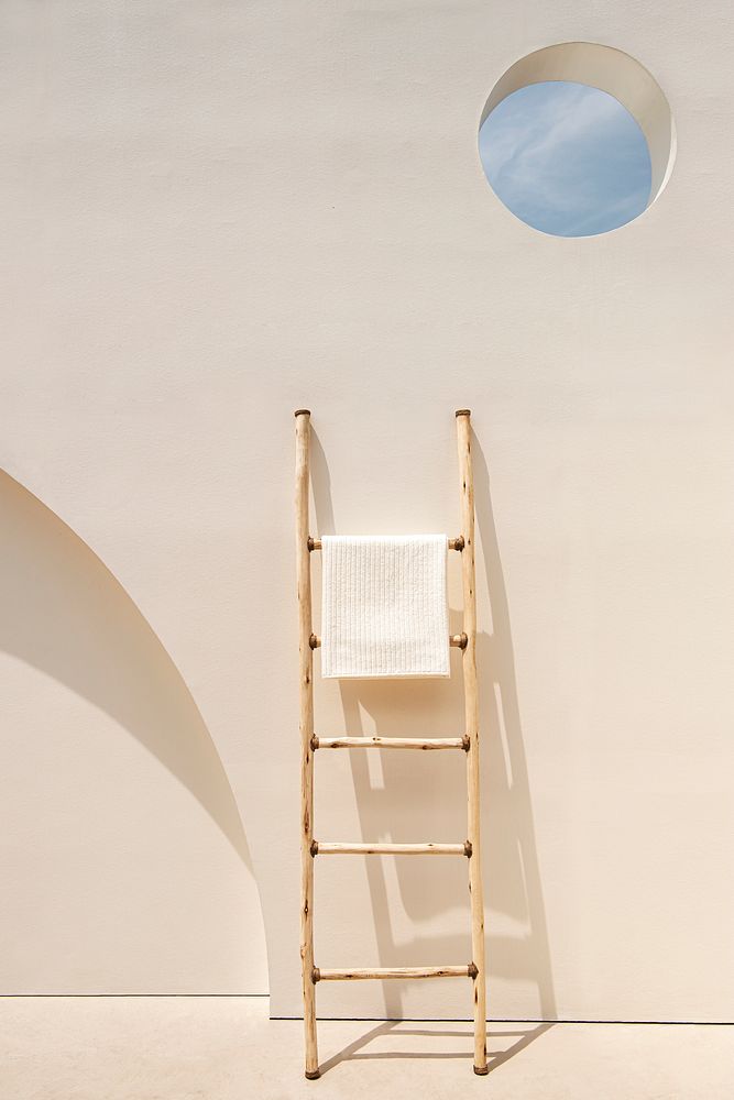 Towels hanging on a ladder minimal and aesthetic minimal interior design