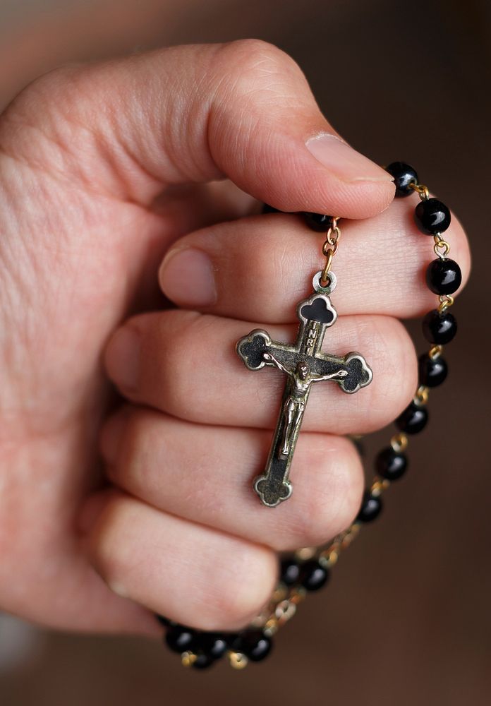 Free holding catholic rosary image, public domain religion CC0 photo.