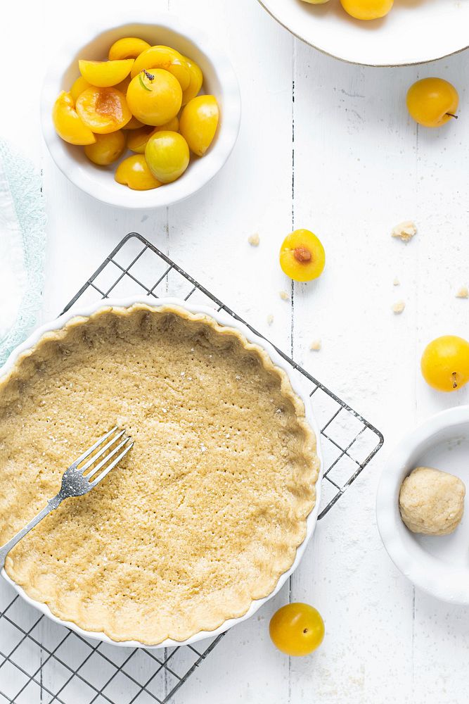 Mirabelle plums by a pie crust