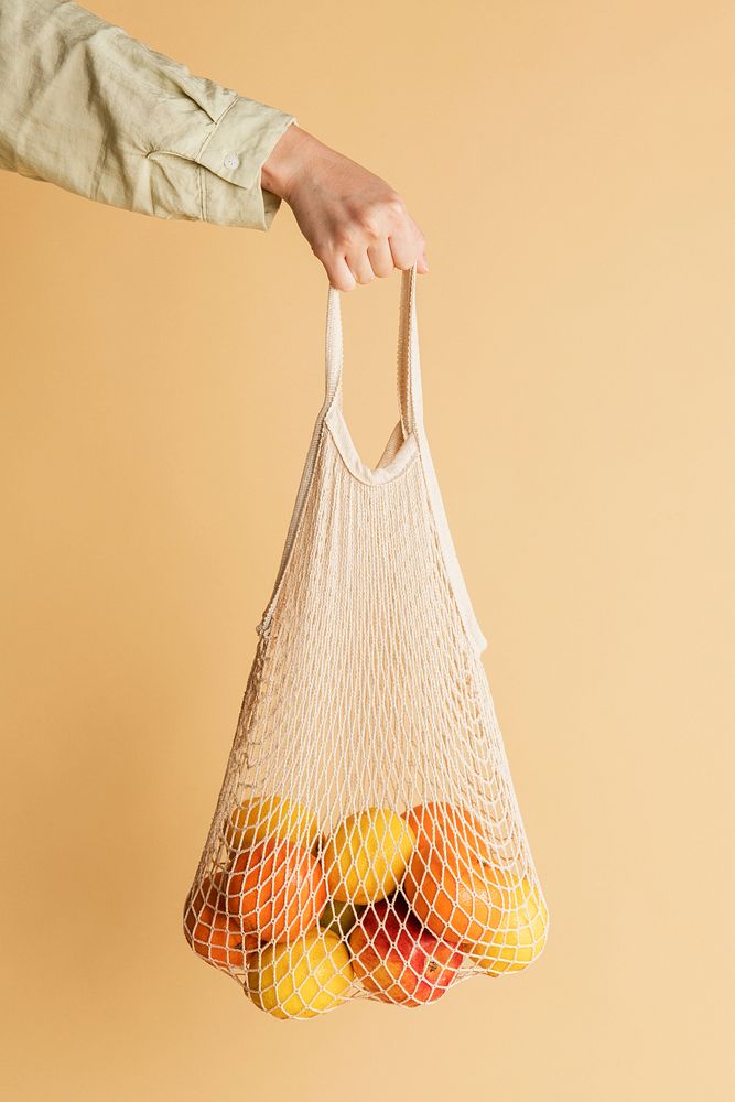 Hand holding a reusable net bag