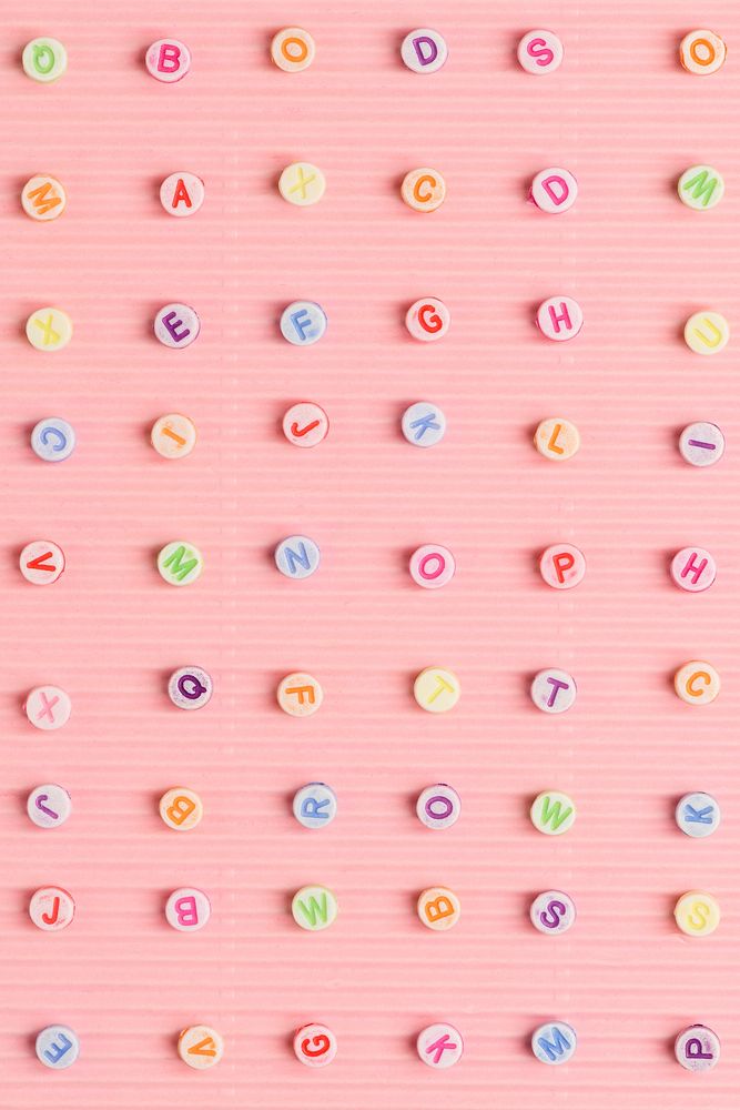 Alphabet beads pattern pink background