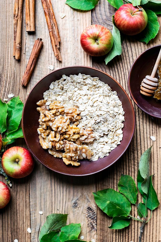 Fresh oatmeal walnuts on wooden table