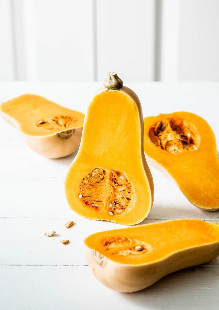 Fresh butternut squash on white table