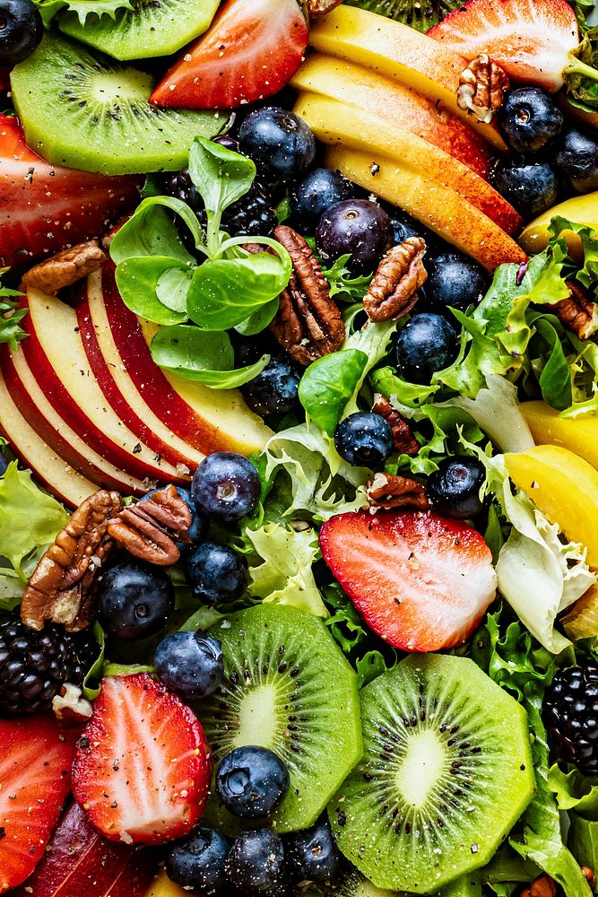 Healthy fruit salad with vegetables and pecans