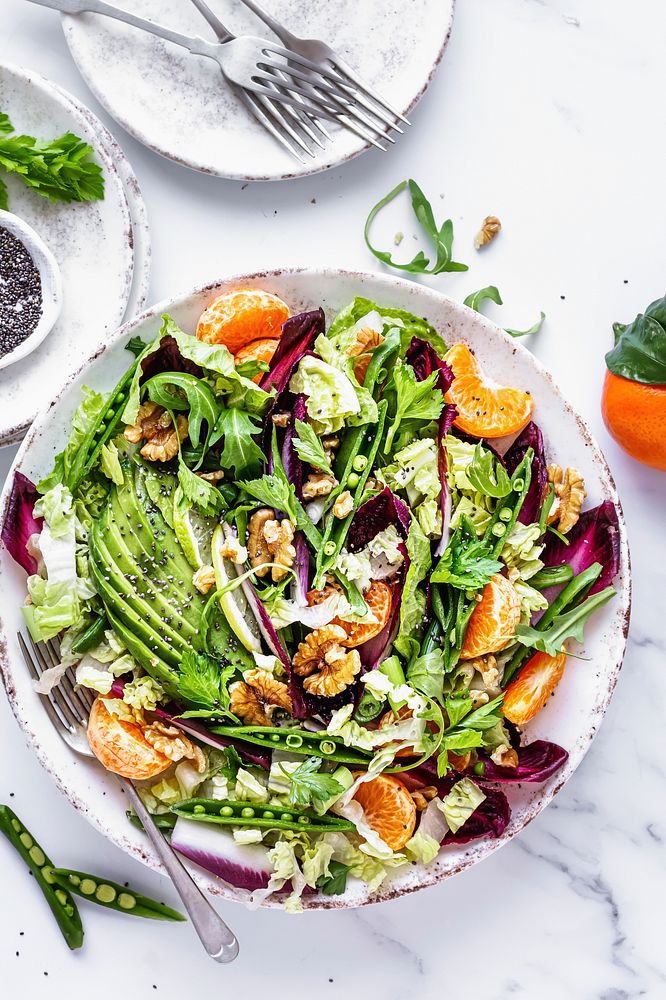 Keto salad with clementines and avocado healthy food
