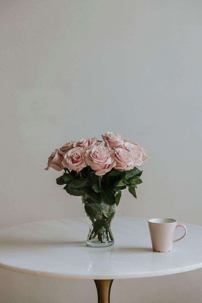 Beautiful pink roses in a vase on a table