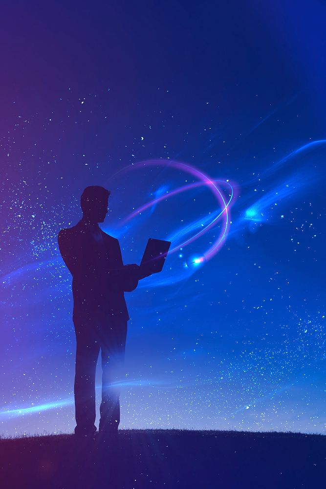 Businessman standing in space with a laptop