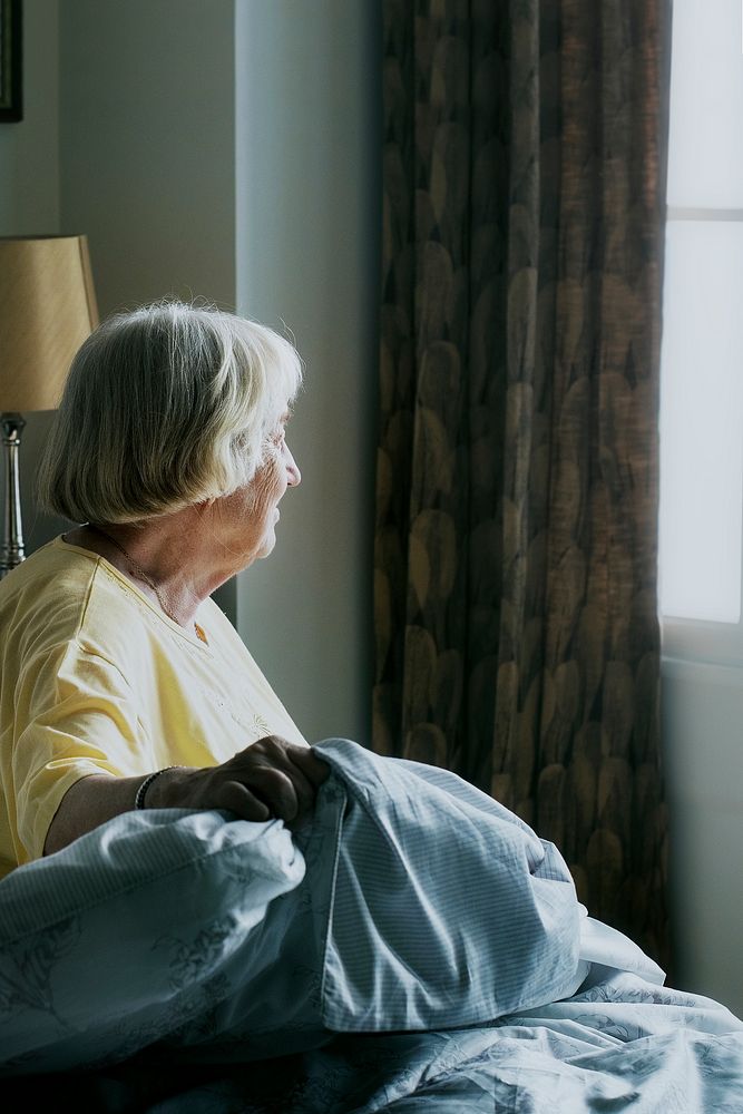 Elderly woman alone at home during social isolation due to Covid-19 pandemic