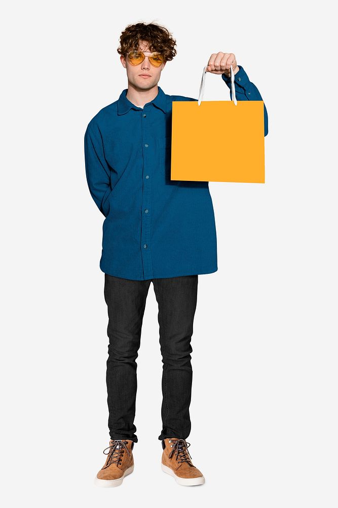 Man holding shopping bag with design space psd