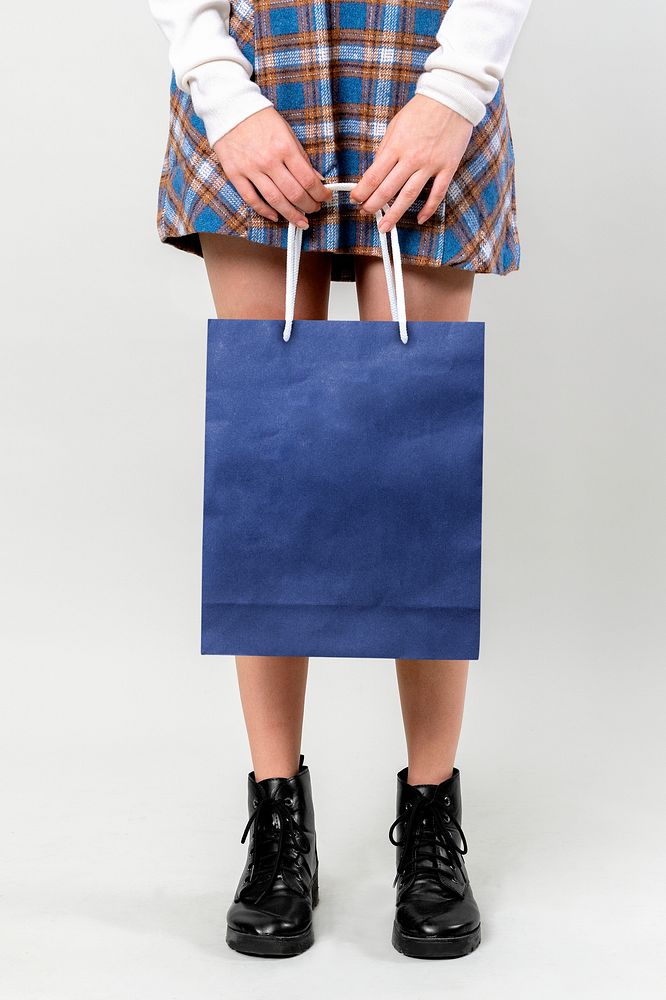 Woman carrying a shopping bag