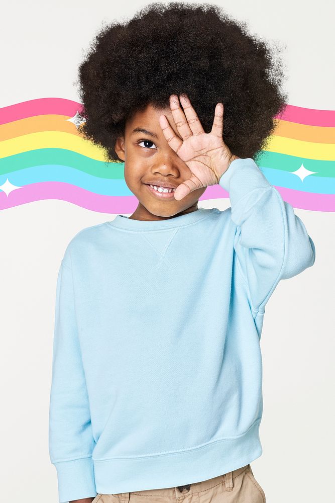 Black boy wearing blue sweater in studio