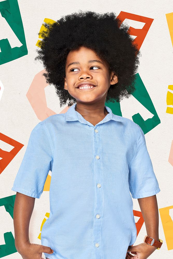 Black boy wearing blue shirt in studio