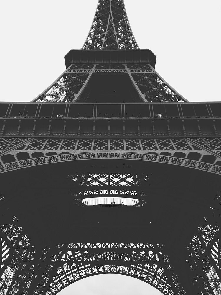 A black-and-white shot of the bottom of the Eiffel Tower. Original public domain image from Wikimedia Commons