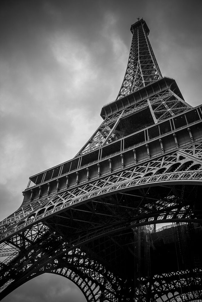 A low-angle shot of the Eiffel Tower in Paris on a cloudy day. Original public domain image from Wikimedia Commons