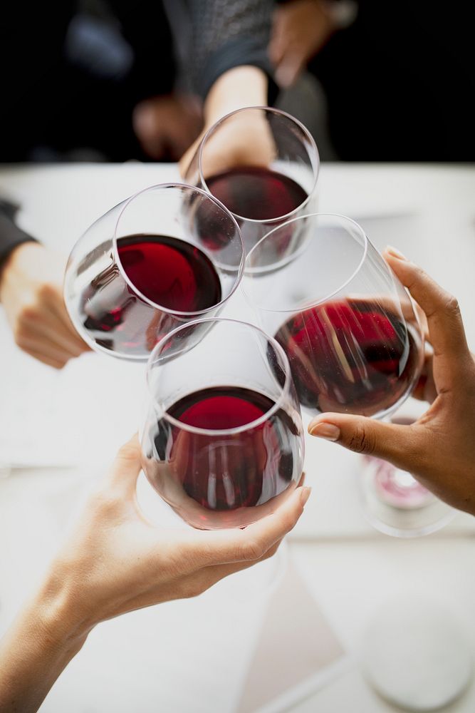 Business people toasting red wine in the office