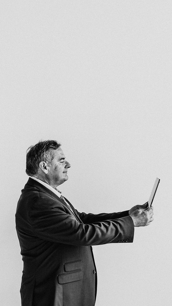 Businessman using a digital tablet grayscale