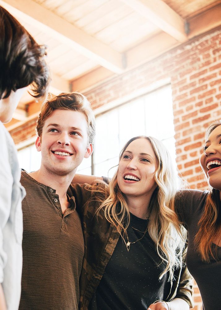 Cheerful diverse people circling together