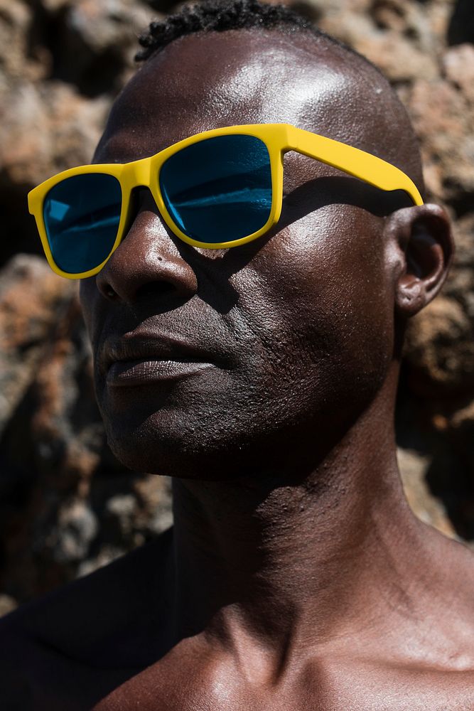 African American man wearing stylish sunglasses summer fashion close up