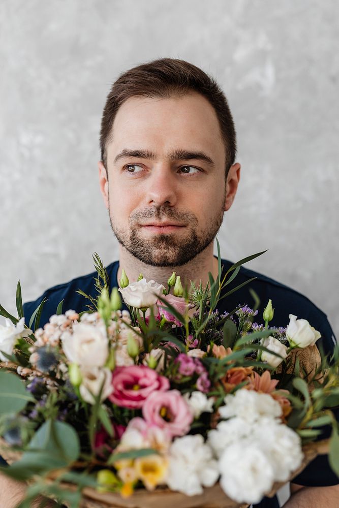 Man holding a bouquet of flowers