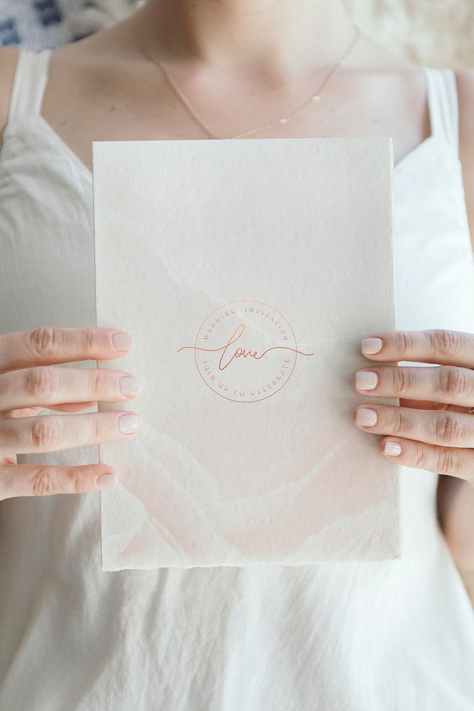 Bride holding a love white card