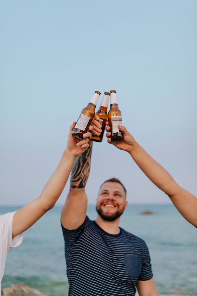 Guys having beers at the beach