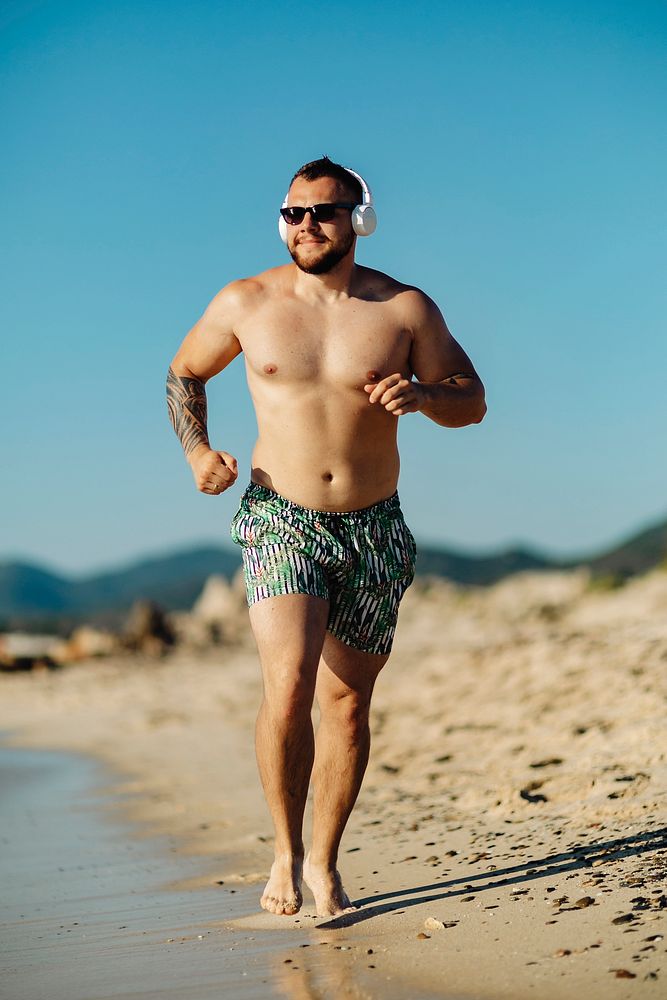 Man jogging along the beach