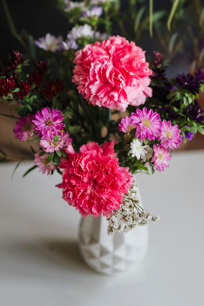 Pink flowers in a white vase
