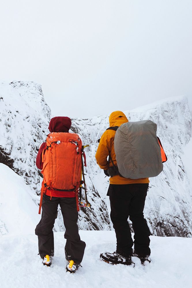 Hikers up in Reinebringen in the Lofoten Islands, Norway