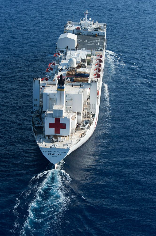 The hospital ship USNS Comfort (T-AH 20) sails through the Atlantic Ocean en route to Kingston, Jamaica, April 11, 2011, as…