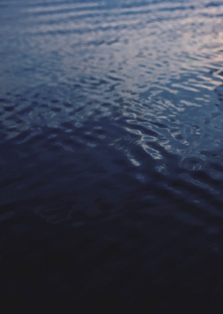 Dark blue ocean water ripples background