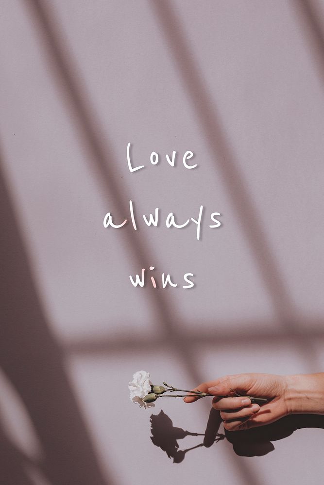 Love always wins quote on a natural light background