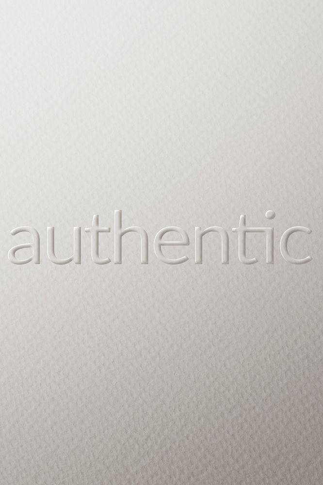 Authentic embossed font white paper background