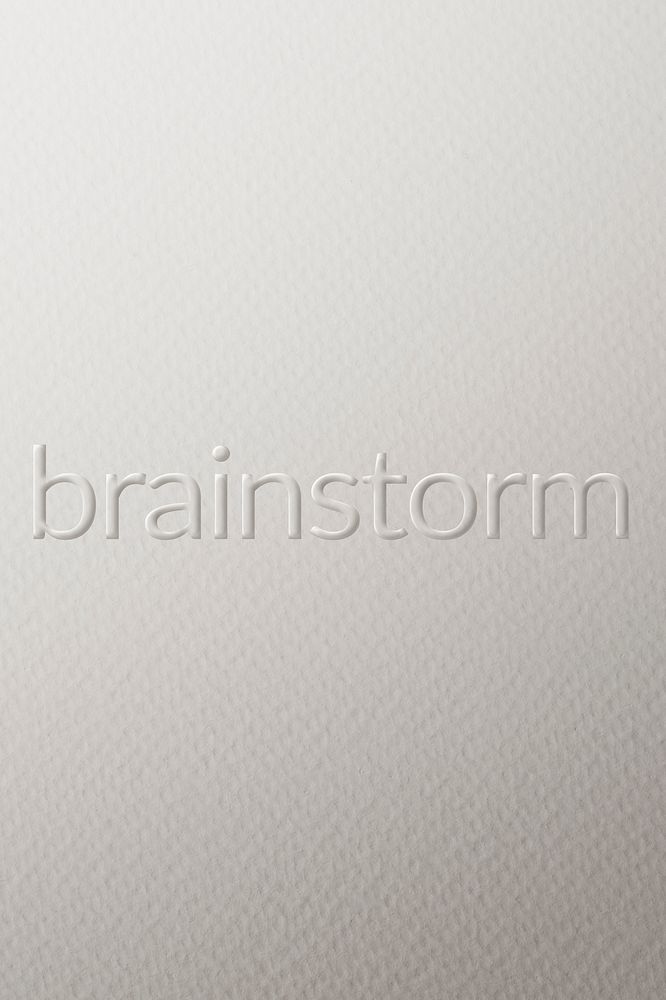 Brainstorm embossed text white paper background