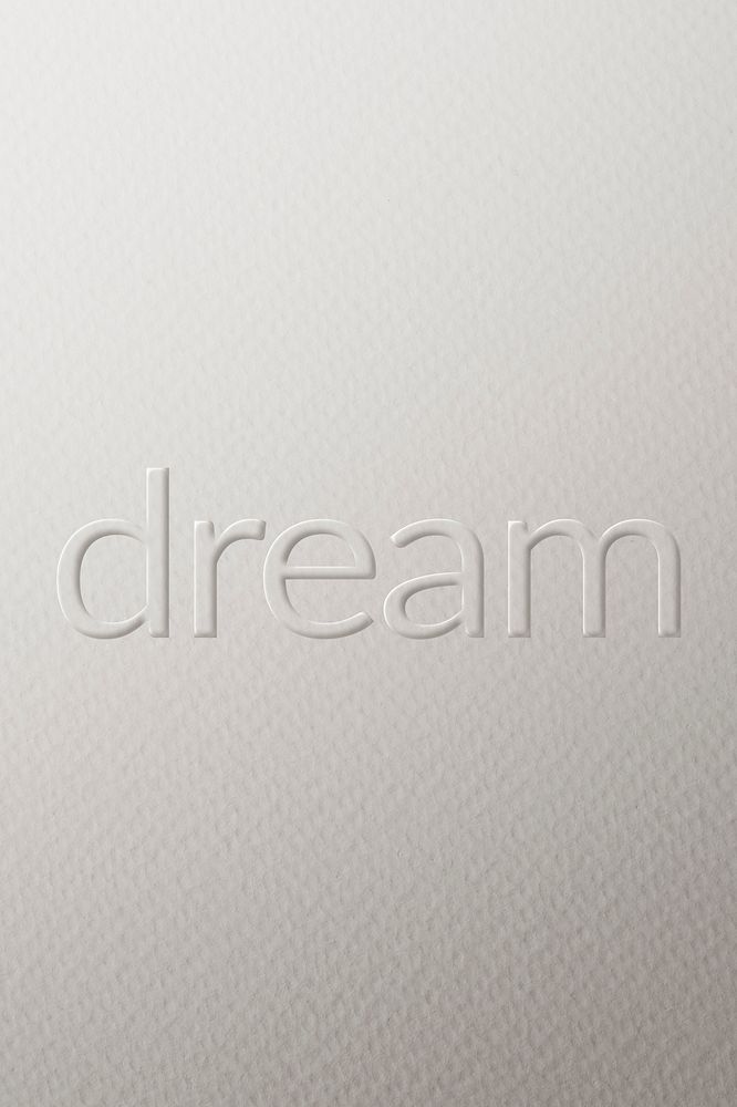 Dream embossed font white paper background