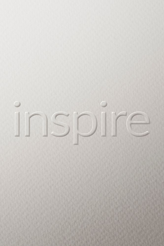 Inspire embossed font white paper background