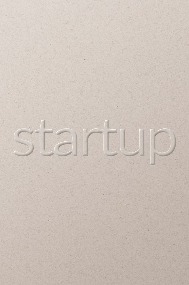 Startup embossed text white paper background
