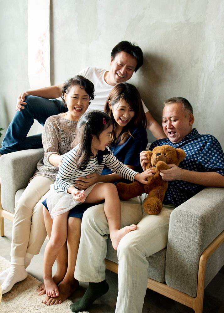 Happy extended Asian family spending time together