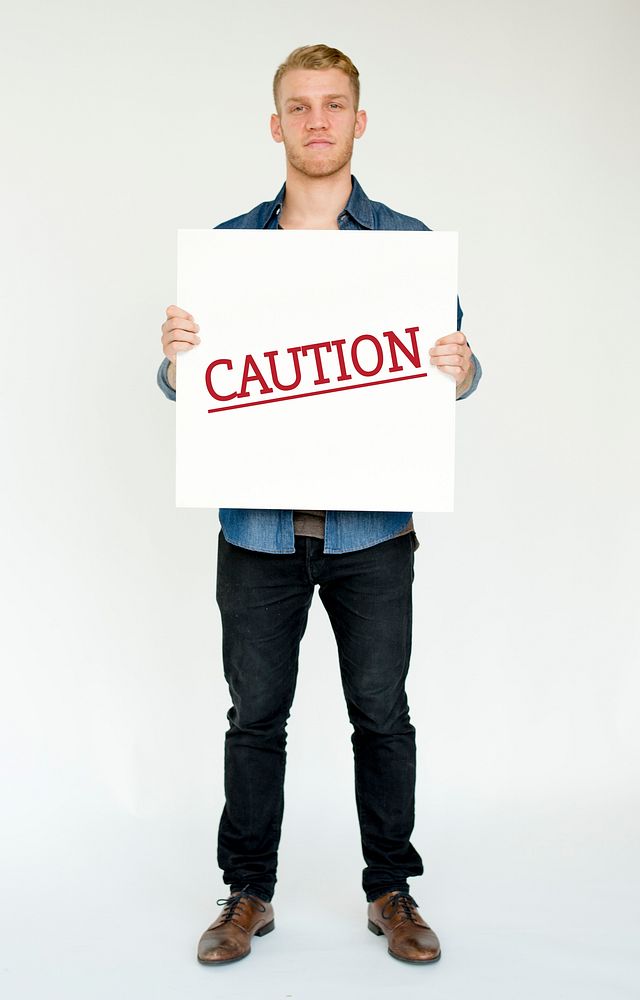 Man hold caution alert sign