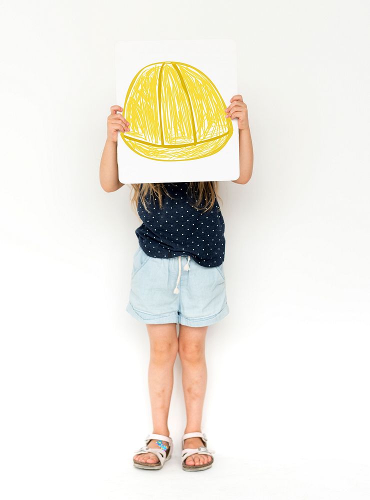 Child with a drawing of engineer safety helmet