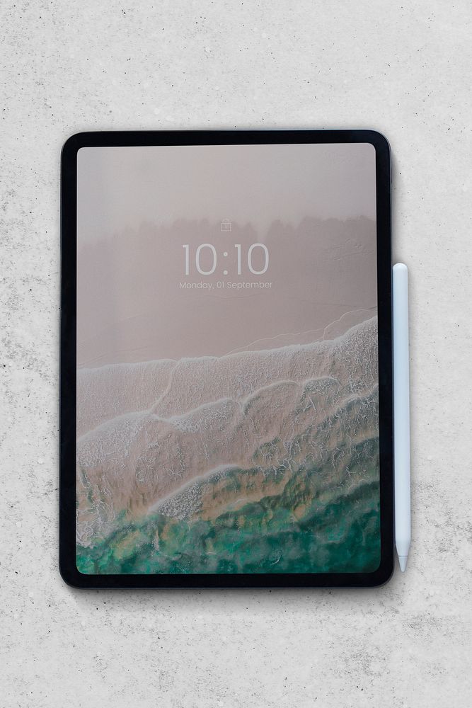 Digital tablet on white marble background