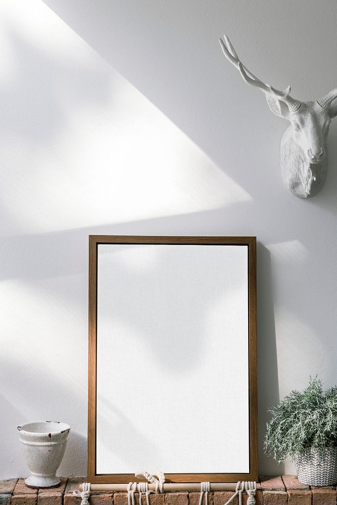 Wooden frame against a white wall