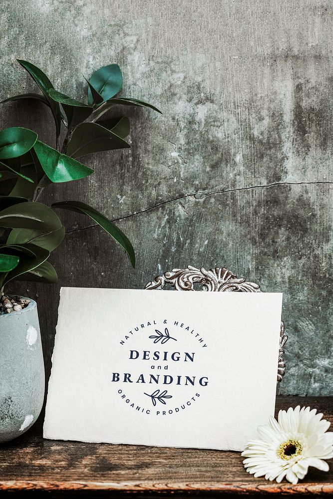 Design and branding card on a wooden table