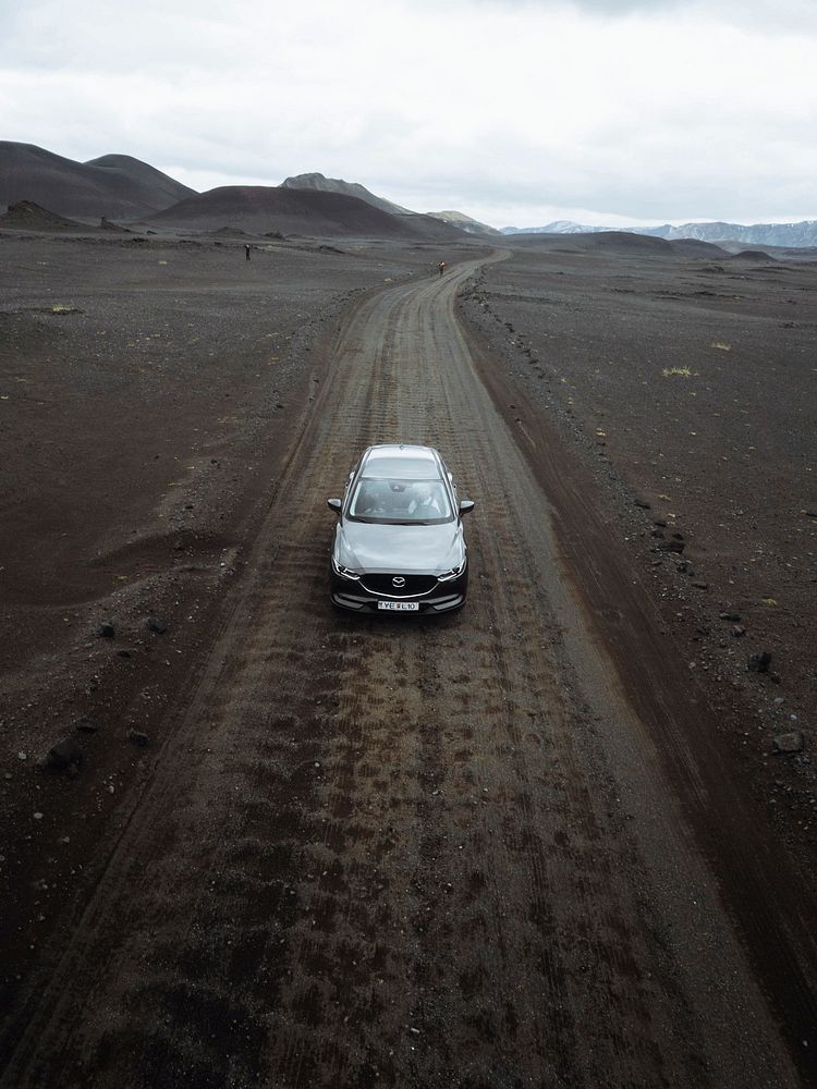 Drone shot of a gray Mazda CX-5 at the Highlands of Iceland