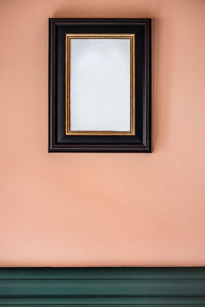 Black frame against a peach wall