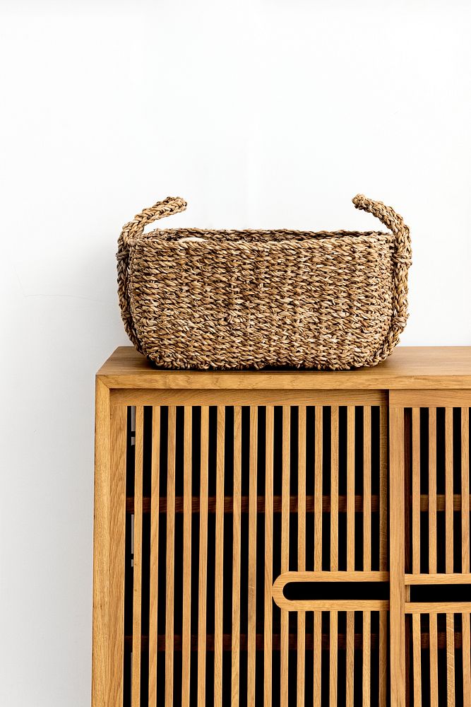 Wicker basket on a vintage wooden cabinet