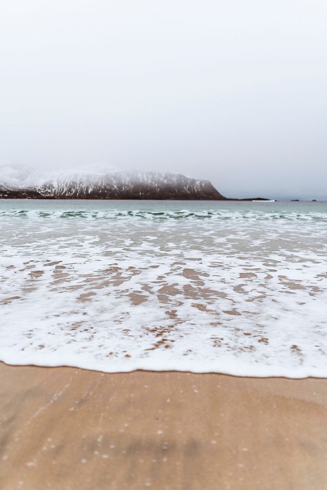 Waves washing ashore in the Lofoten Islands, Norway 
