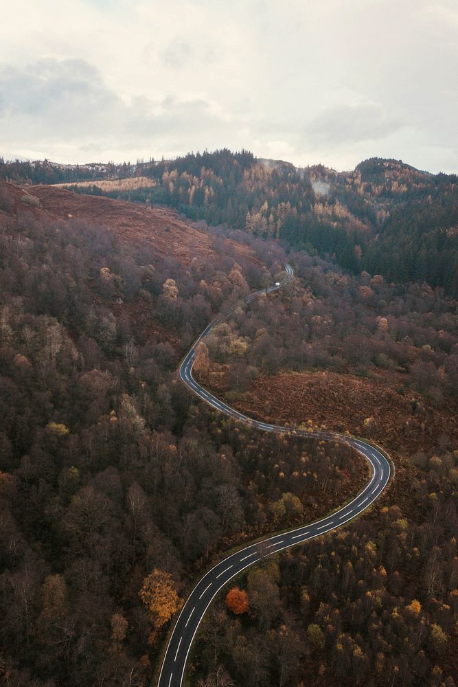 Drone shot of a curvy road in the Trossachs, Scotland