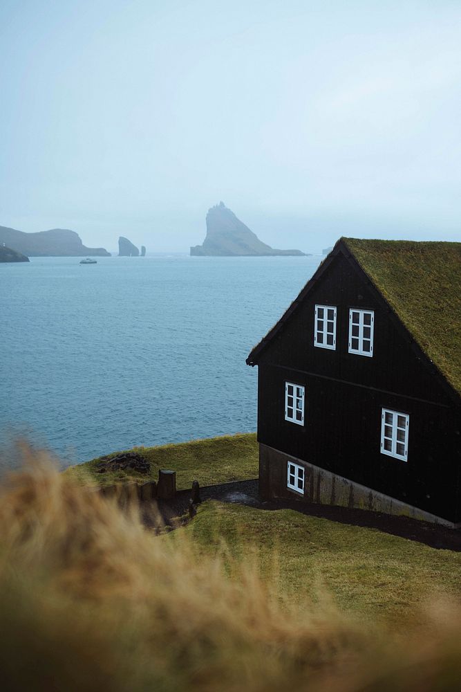 View of Drangarnir through Bour village in the Faroe Islands