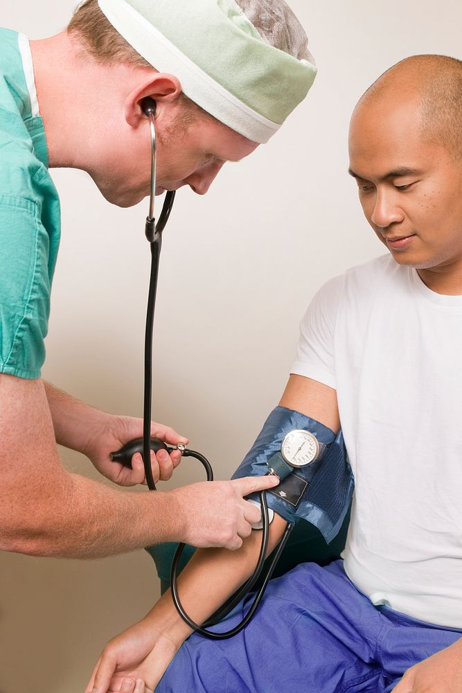 A clinician in the process of conducting a blood pressure examination. Original image sourced from US Government department:…